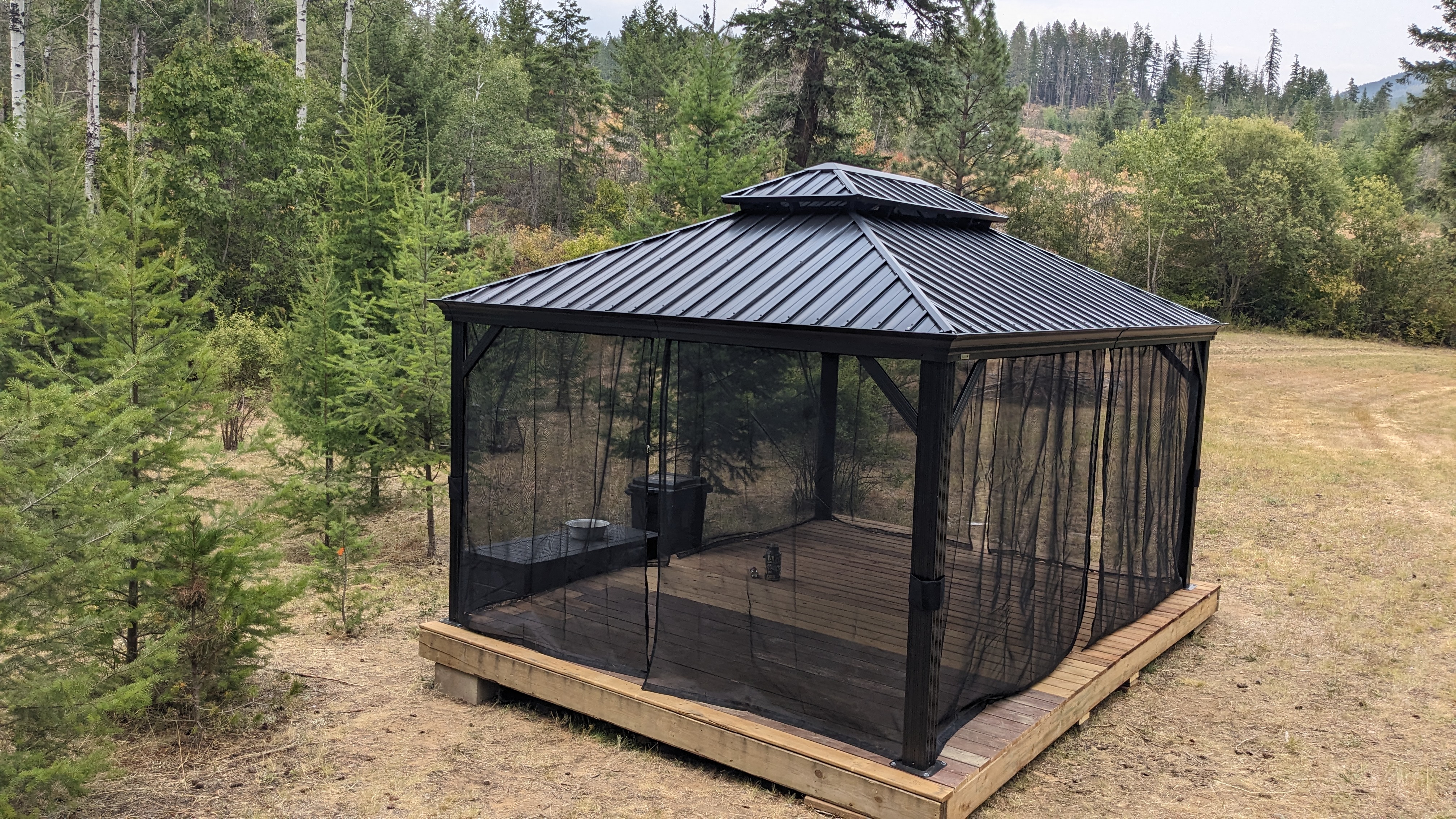 Screened gazebo on the property